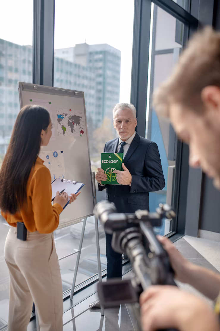 grey haired man looking interested talking young reporter studio 259150 8745